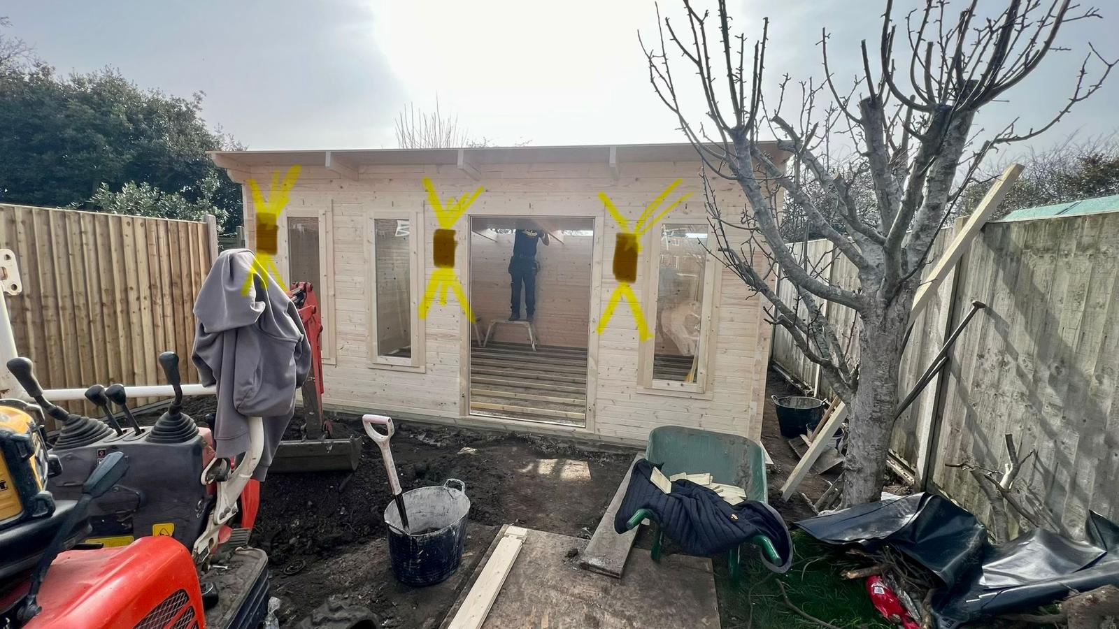 Garden room lighting plan marked up on exterior wall