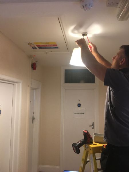 Light fitting being changed